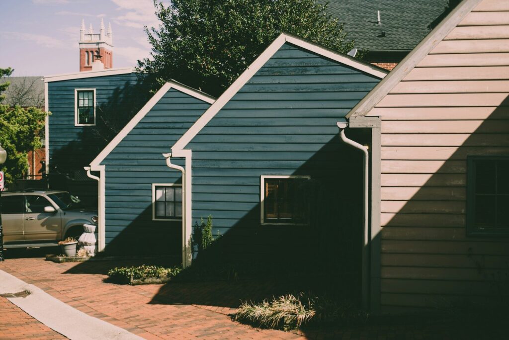 a row of houses with a car parked in front of them